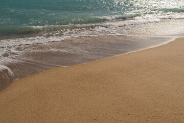 Warm day on a Cannes beach with azure waves of mediterranean sea