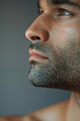 close up of man's face with clean shaven chin, no hair on his jawline, 