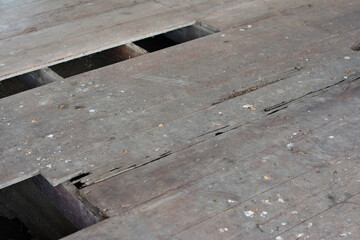 Declination of old wooden balcony or platform.Interior of a dirty and dilapidated room in an abandoned house.
