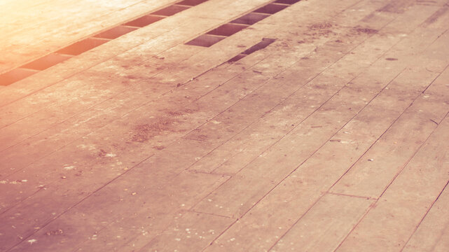 Declination of old wooden balcony or platform.Interior of a dirty and dilapidated room in an abandoned house.