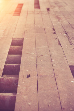 Declination of old wooden balcony or platform.Interior of a dirty and dilapidated room in an abandoned house.
