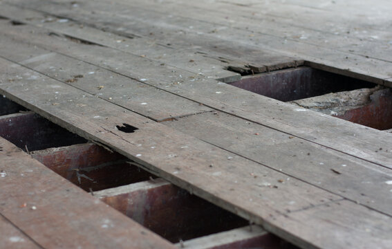 Declination of old wooden balcony or platform.Interior of a dirty and dilapidated room in an abandoned house.