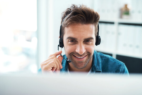 Listening, headset and man with smile, laptop and consultation for help in agency and customer service. Advisor, connect and call center in home office, communication and operator for telemarketing