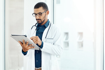 Online, doctor and man with tablet in hospital for patient updates and emergency response. Person, medical and internet for medication administration, clinical documentation and treatment planning.