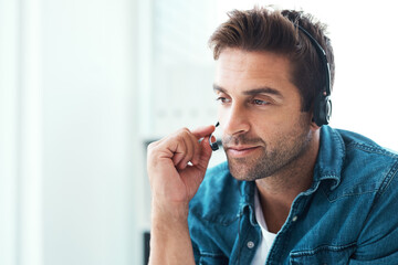 Listening, headset and man with mic, talking and consultation in for help in agency and customer service. Advisor, connect and call center in home office, communication and operator for telemarketing