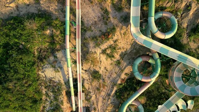 Colorful Water Sliders At Playground Park In Pontevedra, Spain. aerial topdown shot