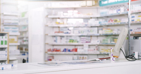 Medicine, pharmacy and desk with shelves in dispensary for prescription healthcare treatment. Medical, chemist and empty pharmaceutical retail drugstore with medication for stock inventory in clinic.