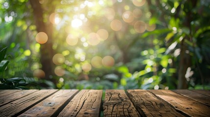 Empty wood table top with blur jungle background with bokeh light