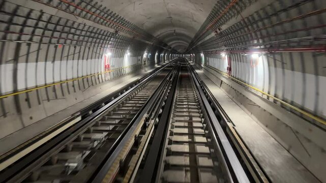 4K. Time lapse automatic train subway tunnel fast speed. Metro subway with a tunnel and a train moving fast. Tube lines in the tunnel. 4K.Time lapse automatic train subway tunnel fast speed
