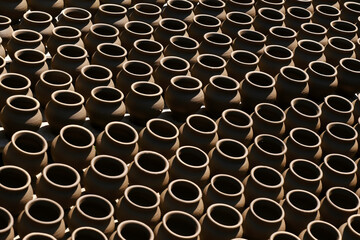 A potter crafts earthenware pottery on clay in Pune, India. 