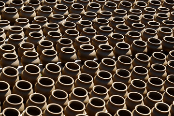 A potter crafts earthenware pottery on clay in Pune, India. 