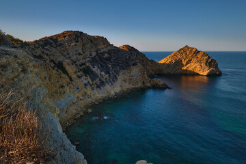 rocky bay calm blue sea