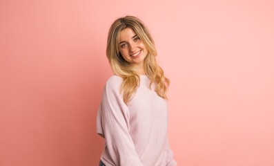 Obraz premium Happy woman shaking head in pink studio