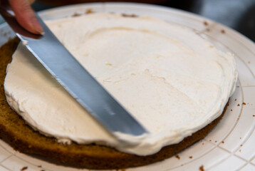 view of making cake with bread and cream