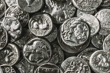 Pile of Ancient Silver Coins © allexxandarx