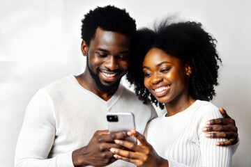 Fototapeta premium Smiling Black Couple Using Smartphone 