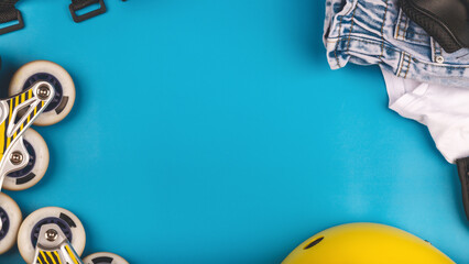 roller skates and body parts protection. top view of inline rollers, helmet, knee pads, wrist...