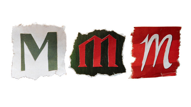 M alphabet torn from a magazine paper. Ransom note style letters.