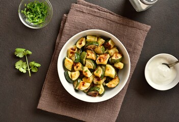 Oven roasted zucchini with garlic and greens