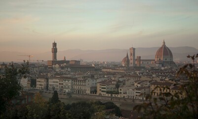 Fototapeta premium Cityscape of Florence against dusk sky at sunset in Tuscany region, Italy