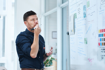 Businessman, thinking and brainstorming in office with whiteboard, thoughts and creative planning for tasks. Project manager, coffee and idea for marketing campaign, strategy development and workflow
