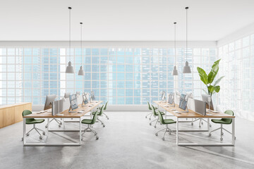 Cozy coworking interior with pc desktops in row, panoramic window