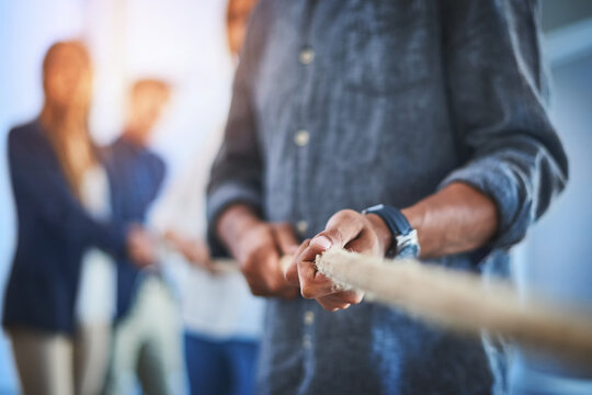 People, tug of war or hands for team building in office with battle, collaboration with game for company. Pull, contest or employee with power or rope in workplace, competition or challenge for staff - Powered by Adobe