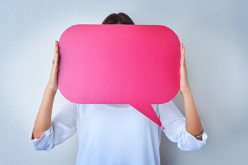 Studio, hands and person with speech bubble for opinion, social media and voice for communication with mockup. Woman, info or marketing for product placement, billboard or paper by gray background