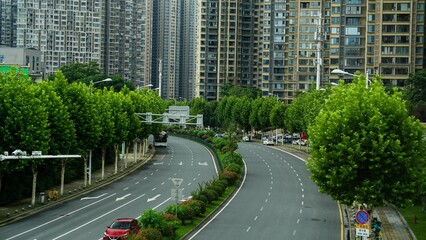 Obraz premium A View of landscape cityscape building house home of Zhangjiajie city and life lifestyle local highway street and traffic road on June 9, 2024 in Hunan, China, Local community.