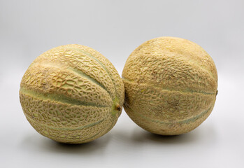 Studio shoot of fresh ripe juicy whole melons closeup.