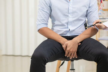 Fototapeta premium A young man was diagnosed with a tumor in his prostate and the medical team diagnosed him with prostate cancer and provided counseling to health care patients to undergo cancer treatment and surgery.
