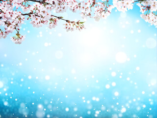 Magical scene with cherry flowers of white color and magic sparks. Beautiful nature spring background. Photo toned in light blue color. Copy space for text
