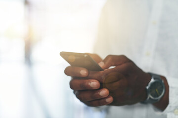 Phone, office and hand of person with online chat, typing and mobile app for social media post. Scroll, networking and business man at digital agency with smartphone, schedule or web connectivity