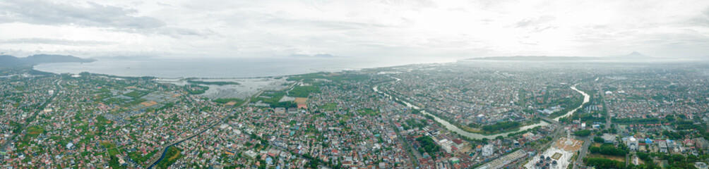 Obraz premium Aerial drone view of cityscape scenery in Banda Aceh, Aceh, Indonesia.
