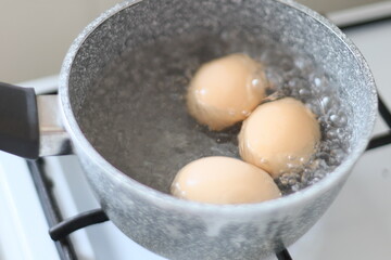 Eggs cooking on a stove, ready for breakfast or snack.