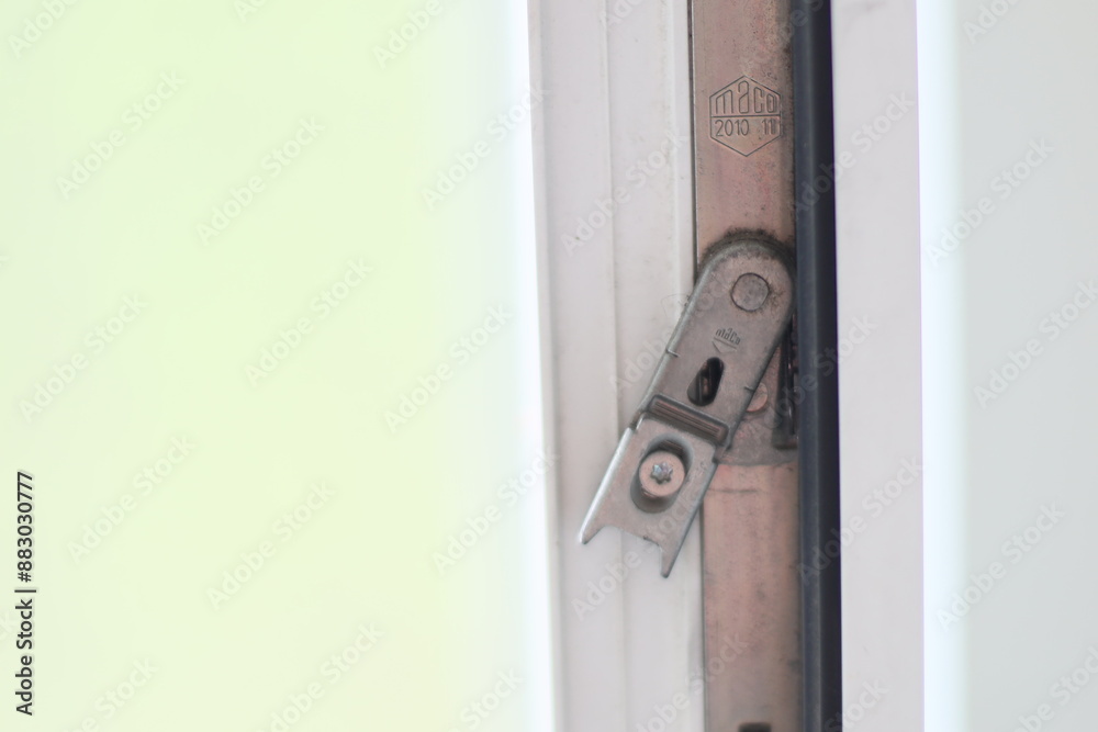 Poster a detailed shot of a door latch and its mechanism, often used in interior design or diy projects.