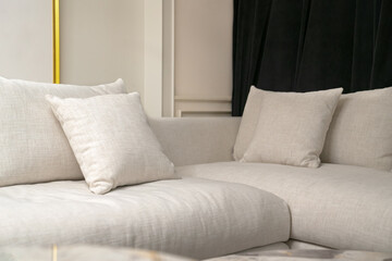 Leisure sofa with pillows in the room.