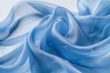 Obraz premium Abstract background wallpaper, close-up of blue fabric, smooth and flowing in the wind, against a white background. The focus is on capturing the texture and softness of the material. curves folds