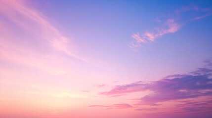 Fototapeta premium Vibrant beautiful sunset sky with clouds in purple and pink hues.