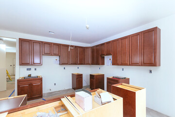 Assembling new custom kitchen cabinet as part of home improvement project