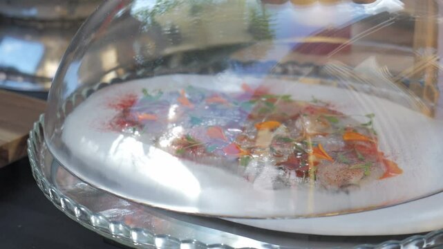 Shrimp carpacio under a kitchen bell