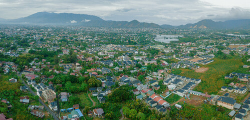 Panoramic aerial drone view of big city skyline scenery in Banda Aceh, Aceh, Indonesia.