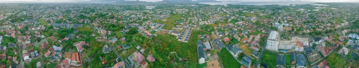 Aerial drone view of big city skyline scenery in Banda Aceh, Aceh, Indonesia.