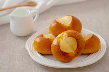 Pretzel buns on white plate