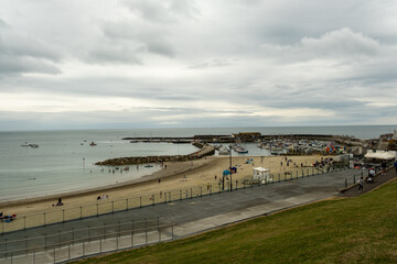 High up view over the beach and harbour in the seaside town of Lyme Regis, Dorset