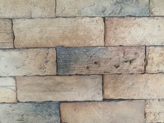 Brown and black brick wall for background image