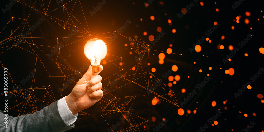 Poster a hand holding a glowing light bulb against a dark background with orange bokeh lights and connected