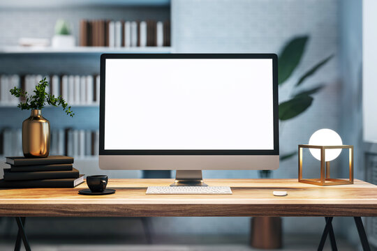 Modern desktop computer with a blank screen on a wooden desk, interior workspace setting, light background, concept of technology. 3D Rendering
