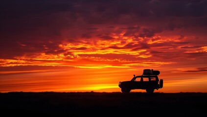 Fototapeta premium jeep goes on a journey in the sunset