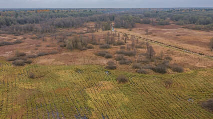 Obraz premium Partly abandoned meadows under cloudy sky